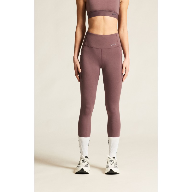 Udobne ženske dolge pajkice CRAFT za tek, fitness in trening. Elastične, neprosojne in z visokim pasom. Popolna izbira za šport. Na voljo v AS Sport Outlet.