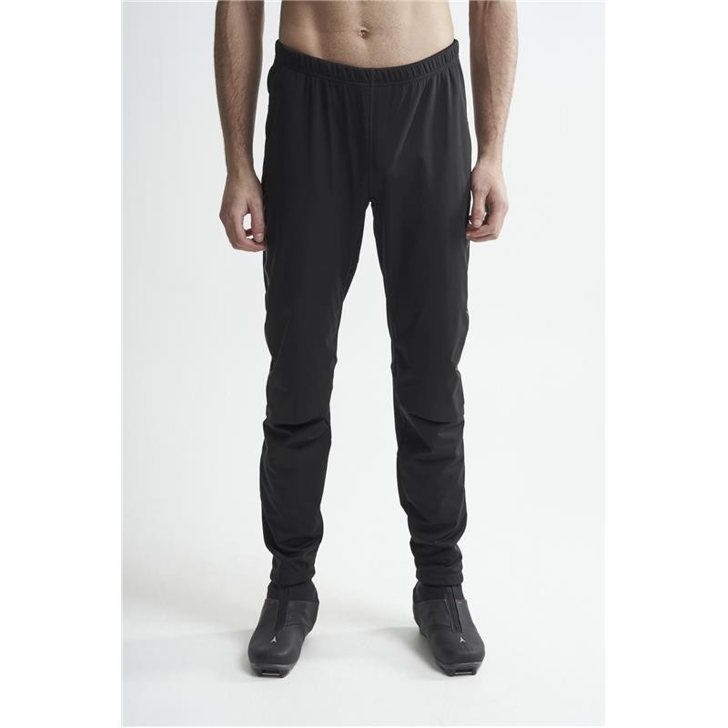 The men's long winter leggings CRAFT ADV NORDIC TRAINING are warm and stretchy leggings designed for cross-country skiers who run even when the wind is blowing hard across the track.
