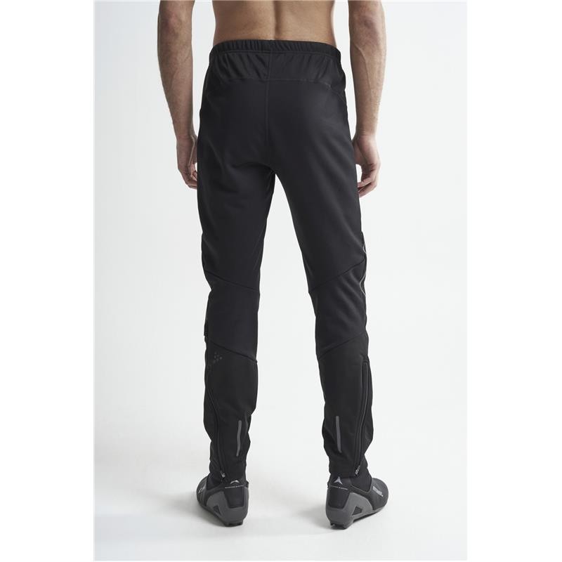 The men's long winter leggings CRAFT ADV NORDIC TRAINING are warm and stretchy leggings designed for cross-country skiers who run even when the wind is blowing hard across the track.