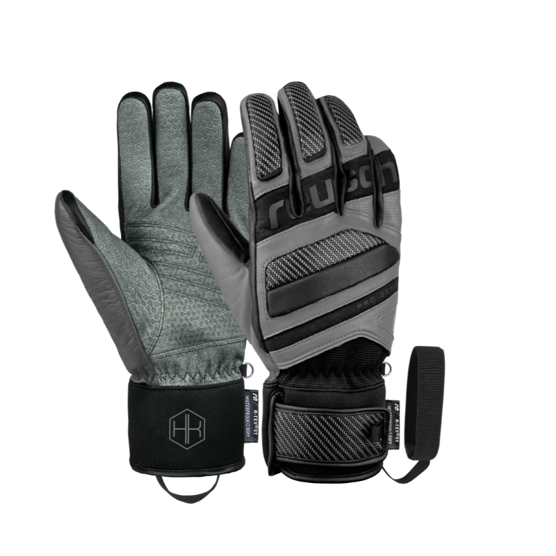 Reusch Henrik Kristoffersen Signature – ekskluzivne usnjene smučarske rokavice z R-LOFT™ izolacijo, karbonsko zaščito in popolnim oprijemom. Elegantna izbira za zahtevne smučarje. Na voljo pri AS Sport Outlet.