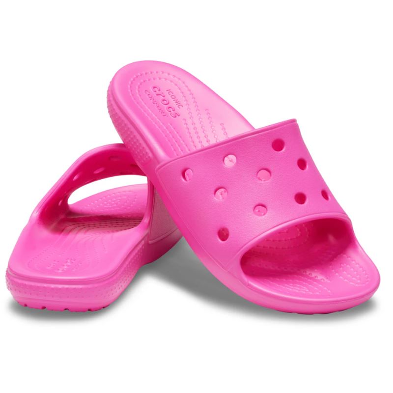 Crocs Classic Slide Kids 206396 so lahki in udobni otroški natikači, zasnovani za enostavno obuvanje in celodnevno igro. Izdelani iz Croslite™ materiala zagotavljajo mehko blaženje, vodoodpornost in hitro sušenje, zato so idealni za plažo, bazen, vrt ali vsakodnevno sproščeno nošenje.