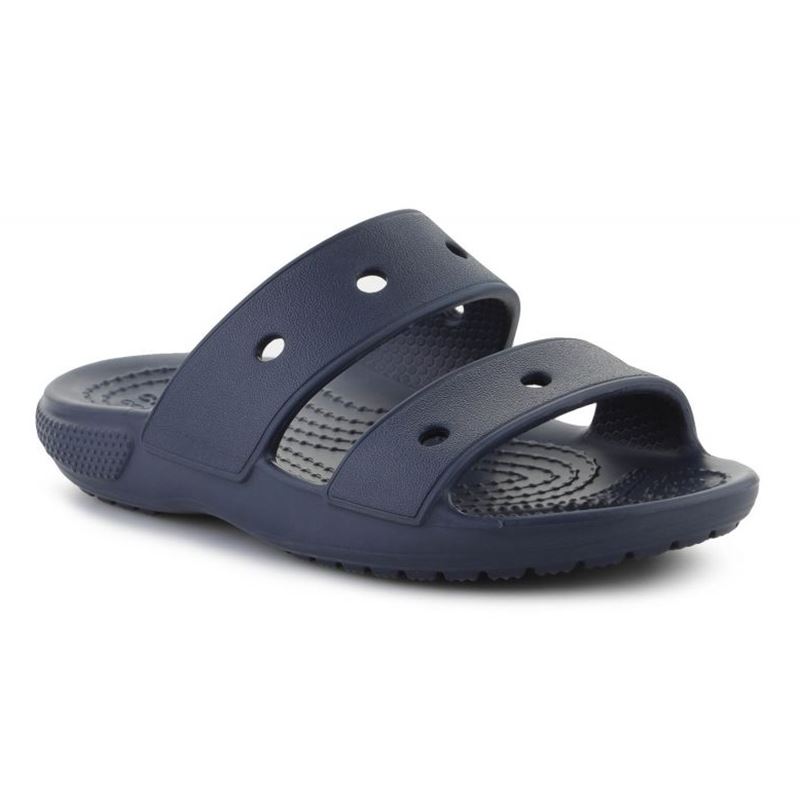 Otroški Crocs Classic Sandal 207536 so prikazani kot lahki in udobni sandali z značilnim preprostim Crocs dizajnom. Model ima dva nastavljiva paščka, ki omogočata stabilno in prilagodljivo prileganje otroškemu stopalu.
