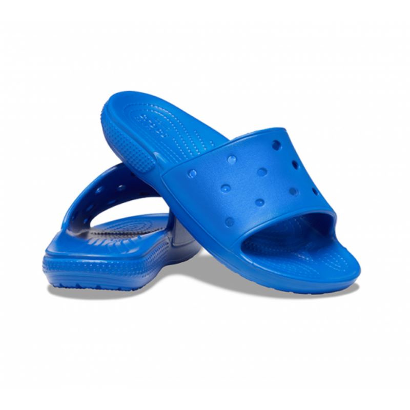 Lahki in udobni natikači Crocs Classic Slide 206121 navdušujejo z minimalističnim dizajnom in vrhunskim udobjem. Izdelani iz Croslite™ pene so mehki, vodoodporni in hitro sušeči, zato so popolna izbira za poletne dni, plažo ali sproščeno nošenje doma.