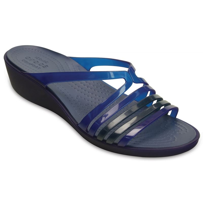 Elegantni natikači Crocs Isabela Mini Wedge 202464 združujejo ženstven dizajn z izjemnim udobjem. Lahka Croslite™ pena in nizka platforma zagotavljata mehkobo, stabilnost in sproščeno hojo skozi ves dan – popolna izbira za poletne dni in vsakodnevni stil.