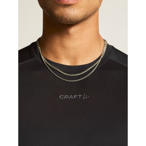Kakovostna moška športna majica CRAFT za tek, fitness in trening. Zračna, hitro sušeča in udobna za aktivne. Na voljo v AS Sport Outlet.
