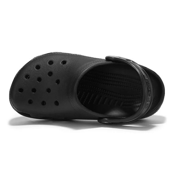 Otroški natikači Crocs Classic Clog K 204536 z lahkotno zasnovo, prezračevalnimi odprtinami in vrtljivim petnim paščkom za udobno vsakodnevno uporabo.