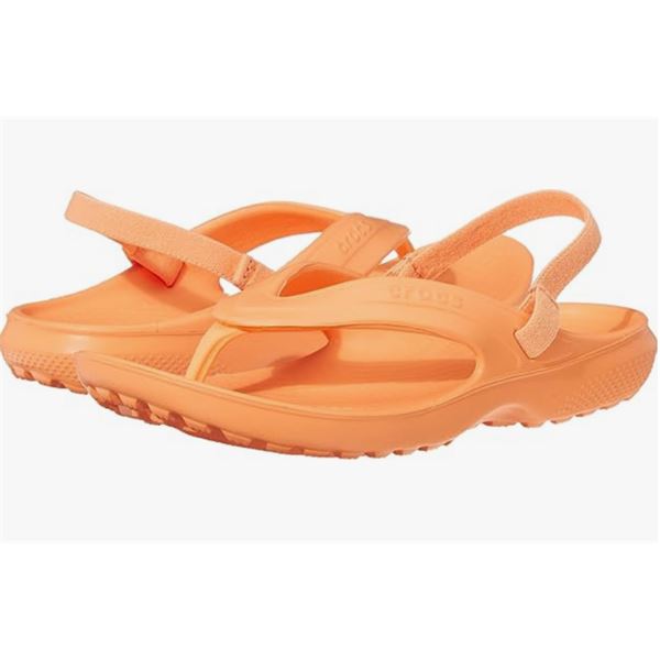 Otroške Crocs japonke Classic Flip Kids 202871 v temno modri barvi z udobnim Croslite™ podplatom in elastičnim paščkom za boljši oprijem. 
