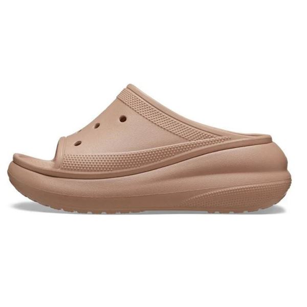 Ženski natikači Crocs Crush Slide 208731 z modernim platformnim podplatom, minimalističnim dizajnom in lahkotno zasnovo za udobne poletne dni.