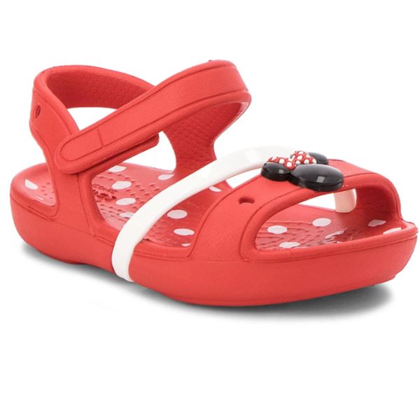 Crocs Lina Minnie Sandal Kids 204999 otroški sandali z Minnie Mouse motivom, nastavljivimi paščki in Croslite™ podplatom za udobje, stabilnost in brezskrbno poletno igro.