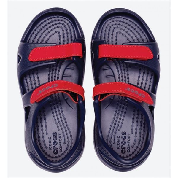 Crocs Swiftwater River Sandal Kids 204988 so lahki otroški sandali z nastavljivimi trakovi, hitro sušečo zasnovo in nedrsečim podplatom. Zagotavljajo udobje, stabilnost in zanesljiv oprijem pri igri, sprehodih ter aktivnostih ob vodi.