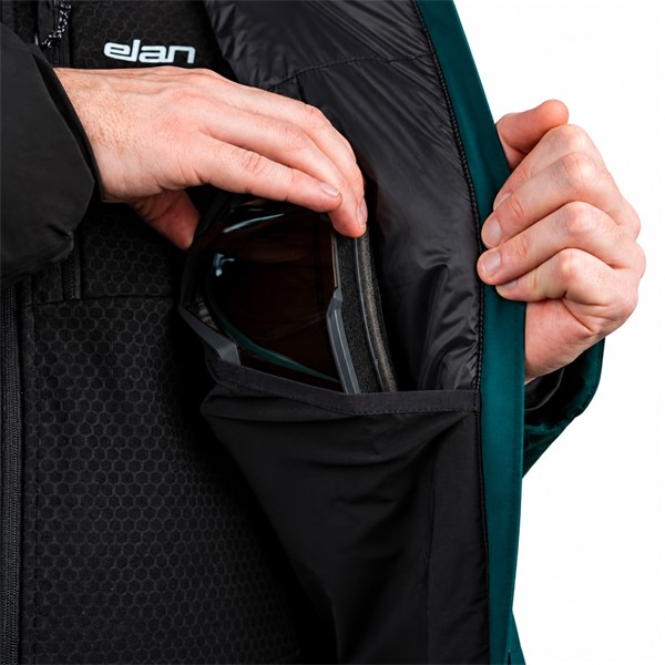 Men's ski jacket ELAN AREH PETROL in a contemporary petrol color. Two-layer construction with polyurethane membrane provides a water column of 20,000 mm and breathability of 20,000 g/m²/24 h. The jacket contains recycled synthetic insulation of 80 g/m² on the torso and 60 g/m² on the sleeves and hood. It is equipped with taped seams, waterproof zippers, underarm ventilation, a two-way adjustable hood for a ski helmet, a pocket for a ski pass, and internal snow protection.