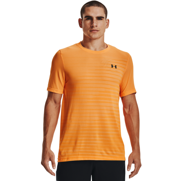 The UNDER ARMOUR SEAMLESS FADE SS 1361133-857 men's sports shirt in orange - designed for comfort during workouts with mesh layers for breathability. The comfortable construction with fewer seams allows for free movement. An ideal choice for active men.