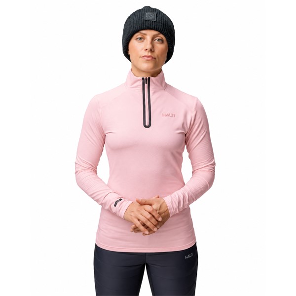 Women's technical ski pullover HALTI JAAKO VEILED PINK in elegant soft pink color. Light Active Dry Sport Knit material 94% recycled polyester and 6% elastane, mesh-structured interior and high collar ensure effective moisture wicking, breathability and freedom of movement for skiing, hiking and other activities.