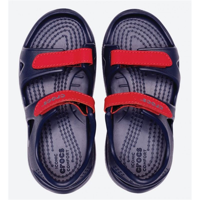 Crocs Swiftwater River Sandal Kids 204988 so lahki otroški sandali z nastavljivimi trakovi, hitro sušečo zasnovo in nedrsečim podplatom. Zagotavljajo udobje, stabilnost in zanesljiv oprijem pri igri, sprehodih ter aktivnostih ob vodi.
