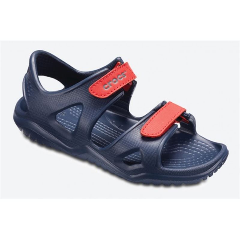 Crocs Swiftwater River Sandal Kids 204988 so lahki otroški sandali z nastavljivimi trakovi, hitro sušečo zasnovo in nedrsečim podplatom. Zagotavljajo udobje, stabilnost in zanesljiv oprijem pri igri, sprehodih ter aktivnostih ob vodi.