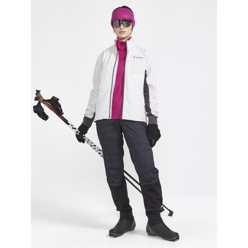 The CRAFT CORE Nordic Training Insulate functional jacket is a versatile jacket primarily designed for cross-country skiing and other intense activities in cold conditions. The jacket features quilted insulation in the front for added warmth,