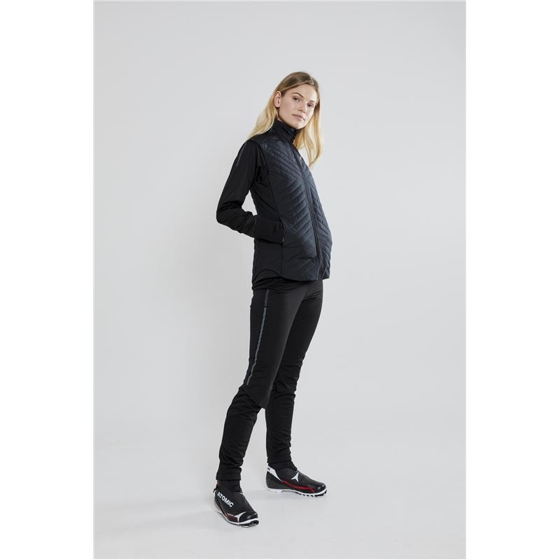 Women's long winter leggings CRAFT ADV NORDIC TRAINING are warm and stretchy leggings designed for cross-country skiers who ski in all conditions and need good protection against cold, wind, and water, while also ensuring optimal moisture transfer outward.