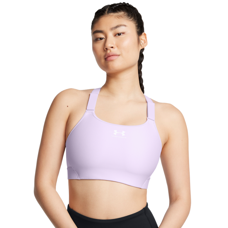 The women's bra UA HeatGear High is designed for active women seeking optimal support and comfort during workouts. Made from innovative HeatGear material, this bra quickly wicks sweat and keeps the skin dry.