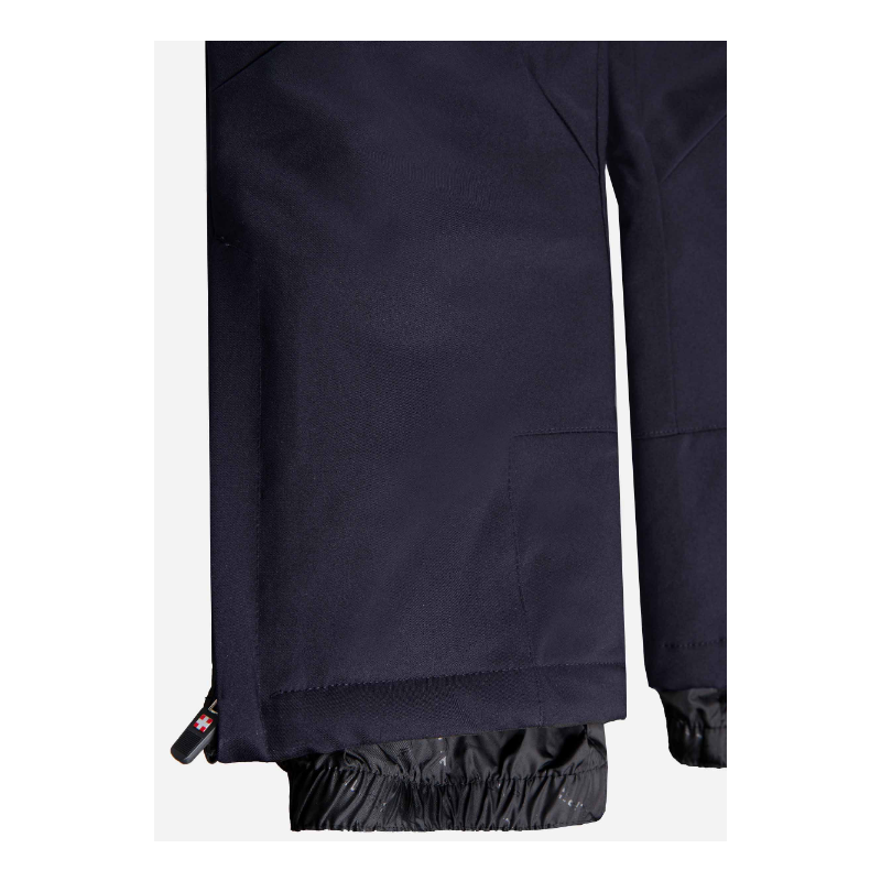 The children's ski pants AULP SAVIO with a waterproof membrane 10K/10K, removable suspenders, and snow gaiters provide warmth and protection in the snow.