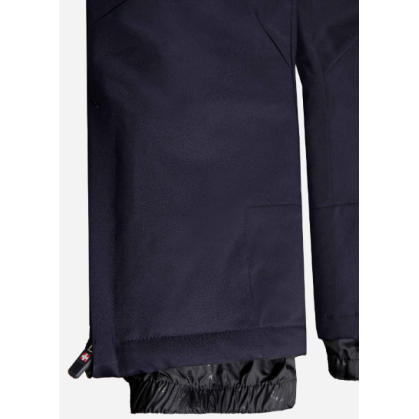 The children's ski pants AULP SAVIO with a waterproof membrane 10K/10K, removable suspenders, and snow gaiters provide warmth and protection in the snow.