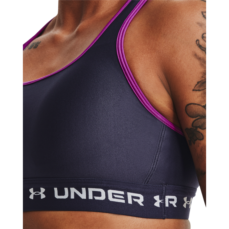Ženski modrček Under Armour Crossback Mid Bra je zasnovan za udobje in oporo med vadbo. Ponuja moderen dizajn z odličnim prileganjem, idealen za športne aktivnosti srednje intenzivnosti